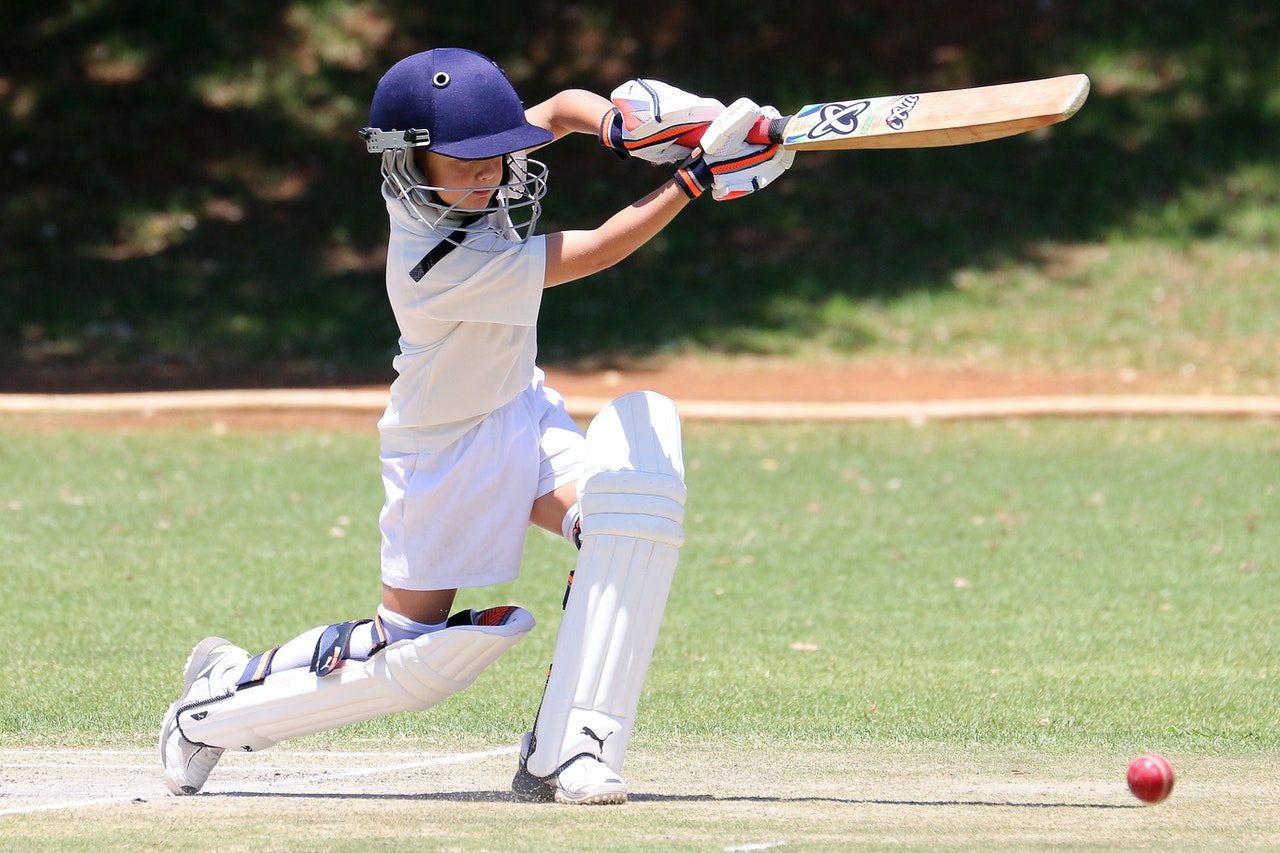 Front Page -Cricket Gear Sales Store kid in white jersey shirt and pants holding baseball bat 3601184